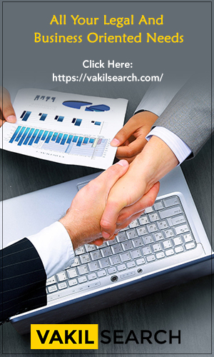 Business professionals shaking hands after a successful online company registration process.