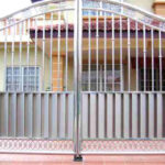 Beautifully designed steel gate in front the residential house