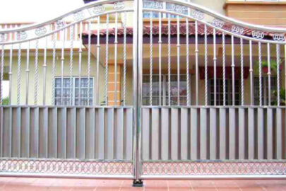 Beautifully designed steel gate in front the residential house